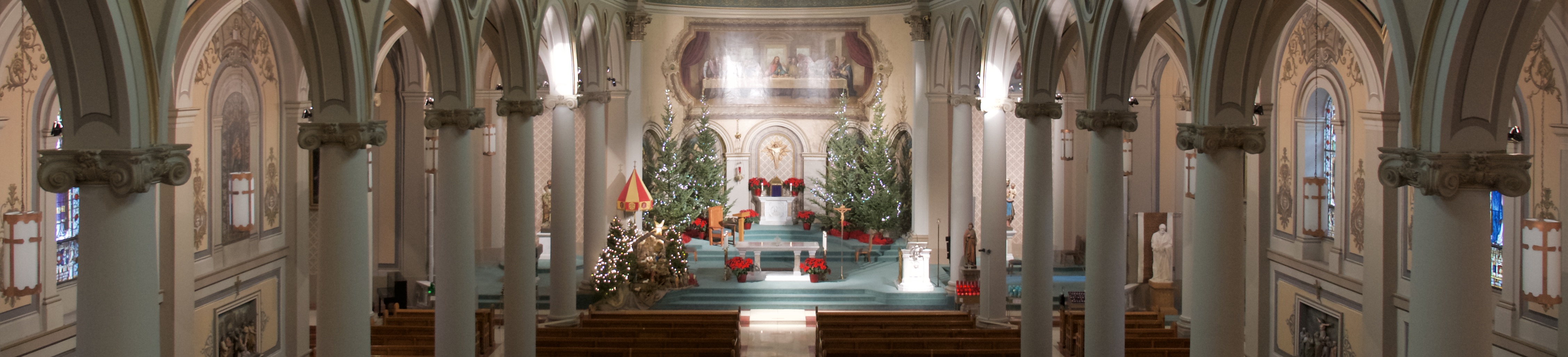 Sanctuary at Christmas with trees and creche