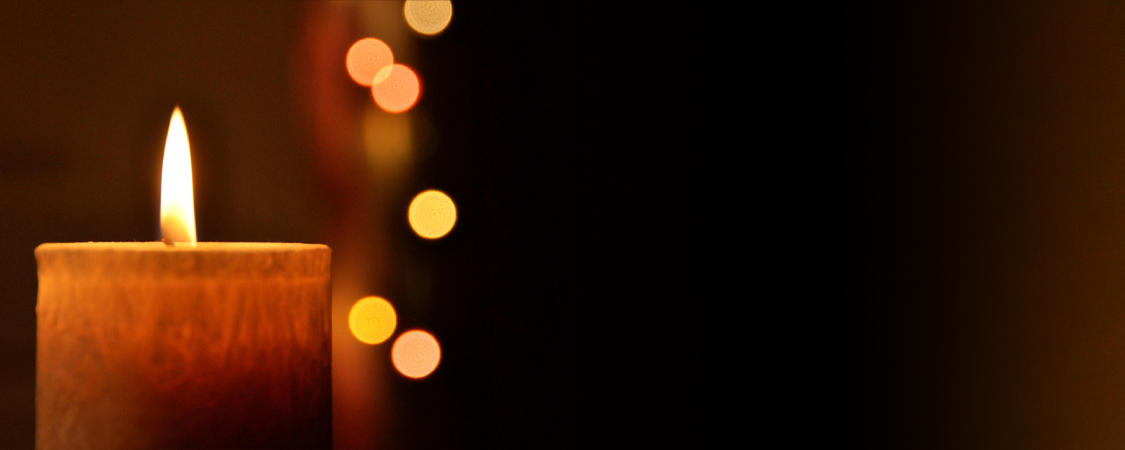 Single Candle with a dark background